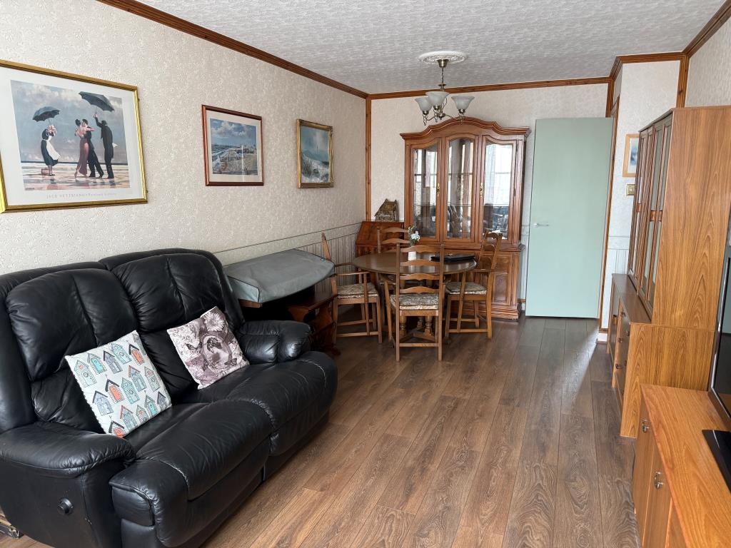 Lot: 111 - BALCONY FLAT FOR UPDATING IN TOWN CENTRE LOCATION - Living room with view from balcony
